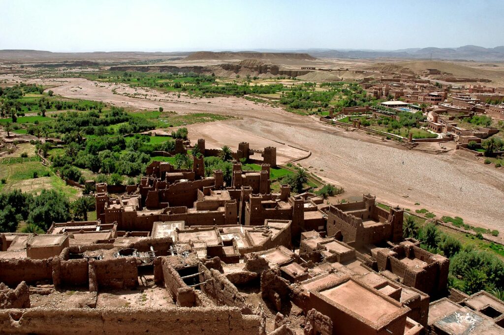 Stunning aerial view of Ouarzazate's ancient kasbahs amidst lush greenery.Morocco itinerary 7 days ,morocco travel